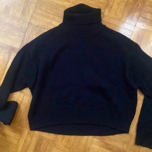 Cropped black turtleneck sweater